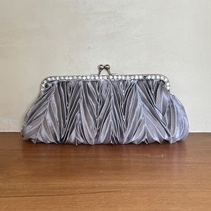Metallic silver clutch with diamonds
